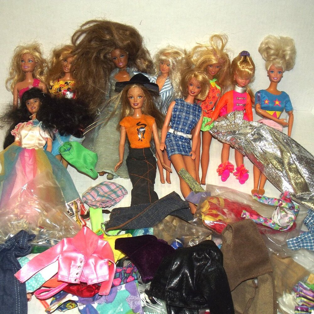 Collection of Barbies and lots of Clothes---Has been Played With